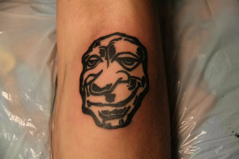 Stylized Face Tattoo