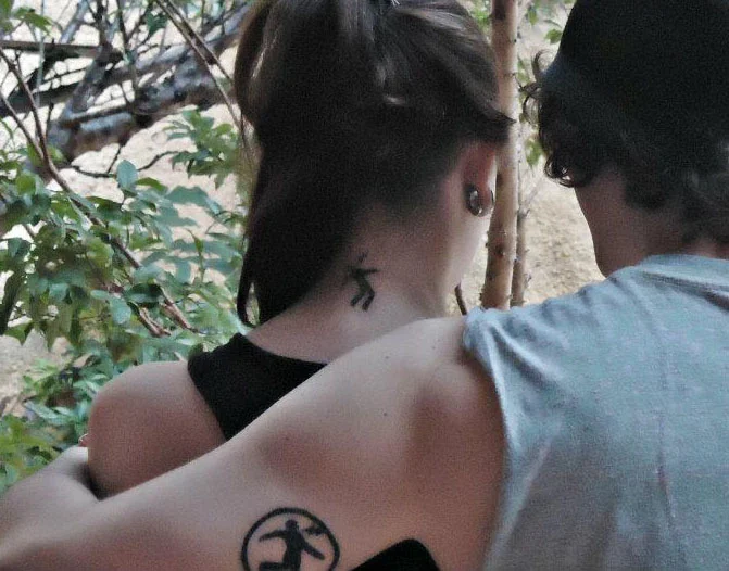 Warning Man Logo Tattoo