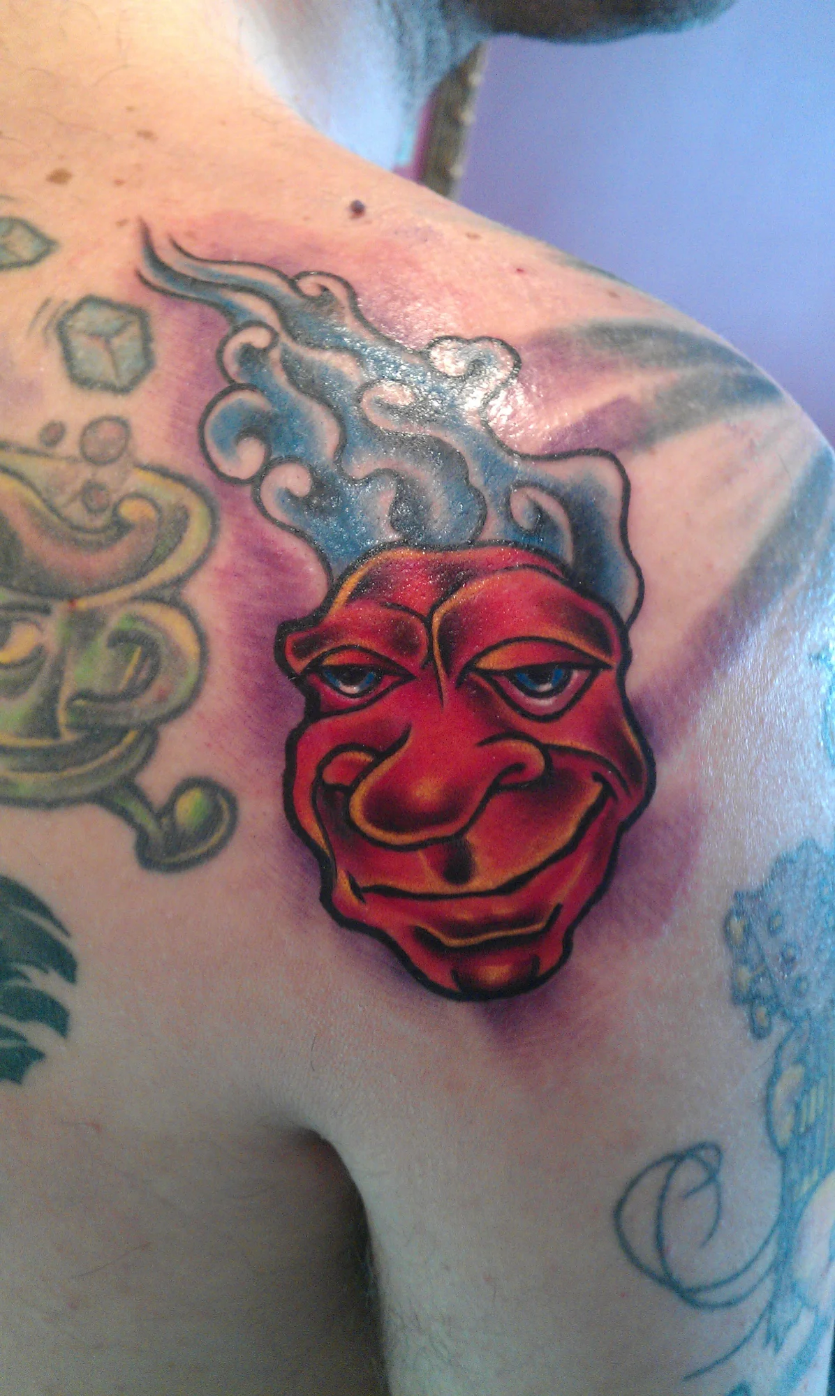 39/Smooth Grinning Face Tattoo