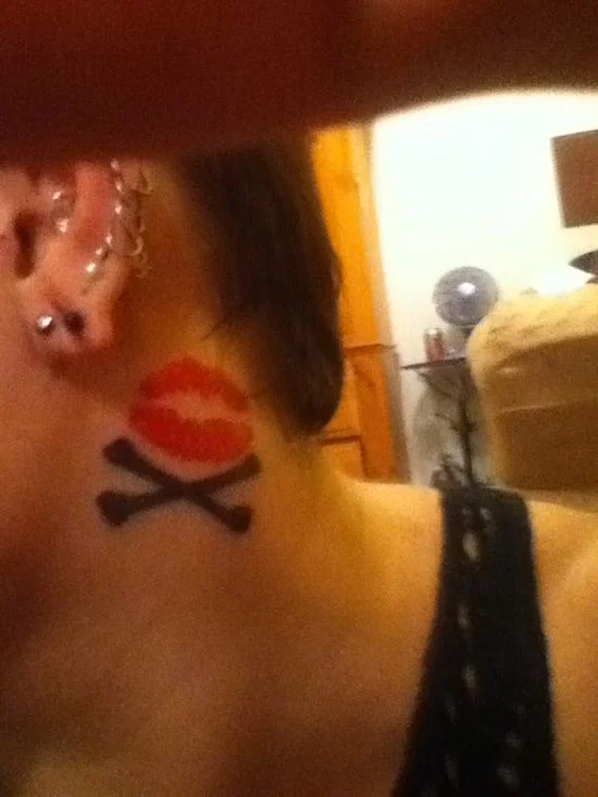 Kiss and Crossbones Tattoo