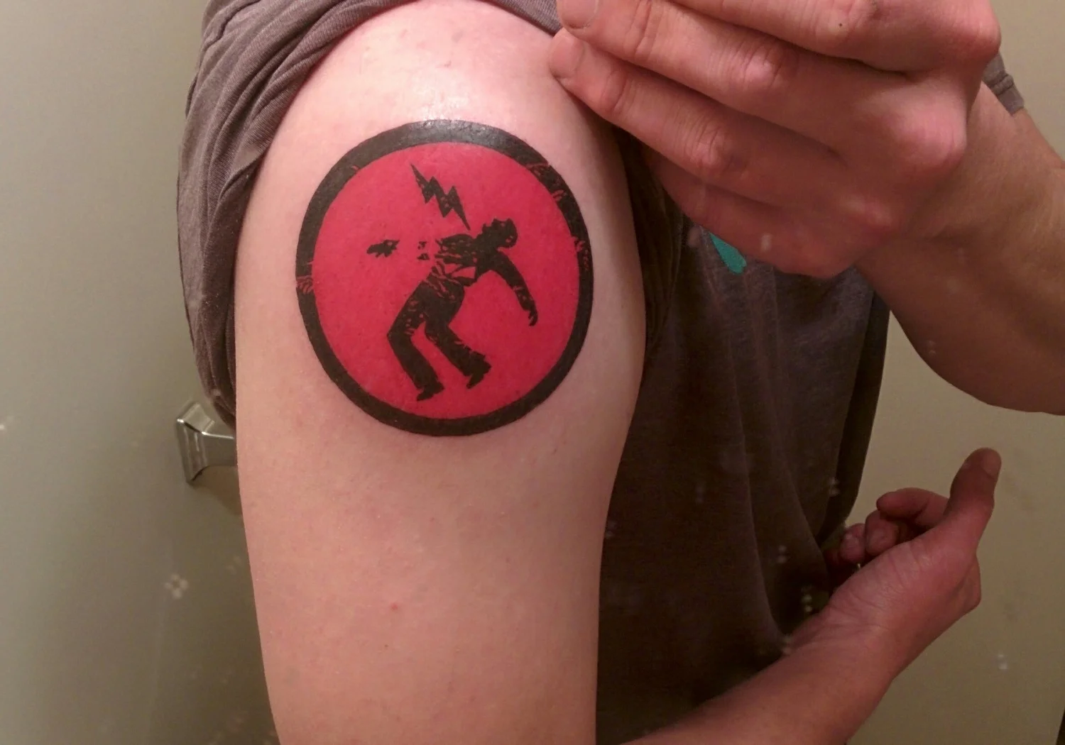 Warning Man Logo Tattoo