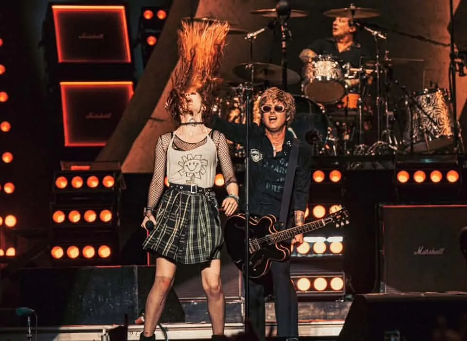 Alana C. on stage with Green Day