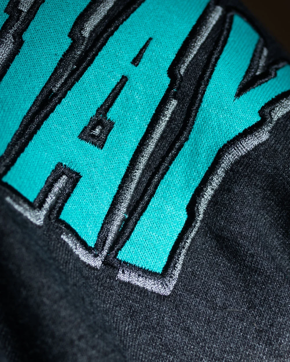 ¡Uno! ¡Dos! ¡Tré! era - grey and turquoise logo hoodie - close-up