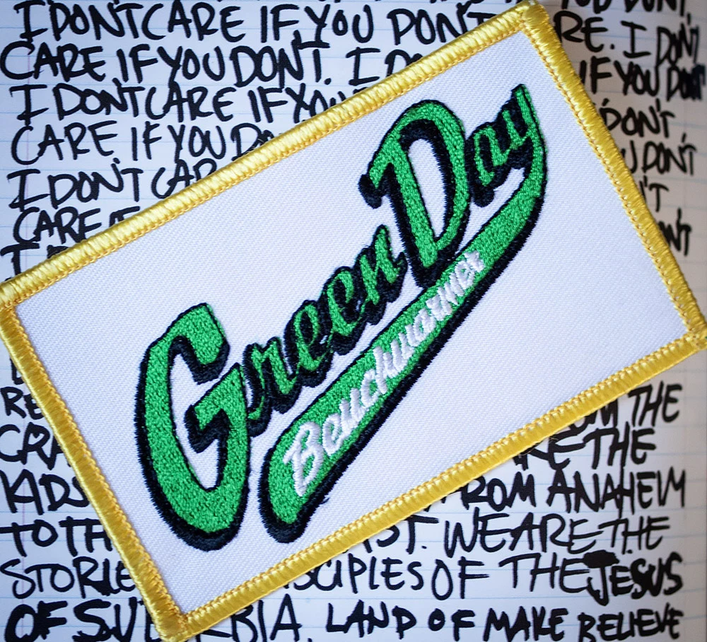 White, gold and green logo patch